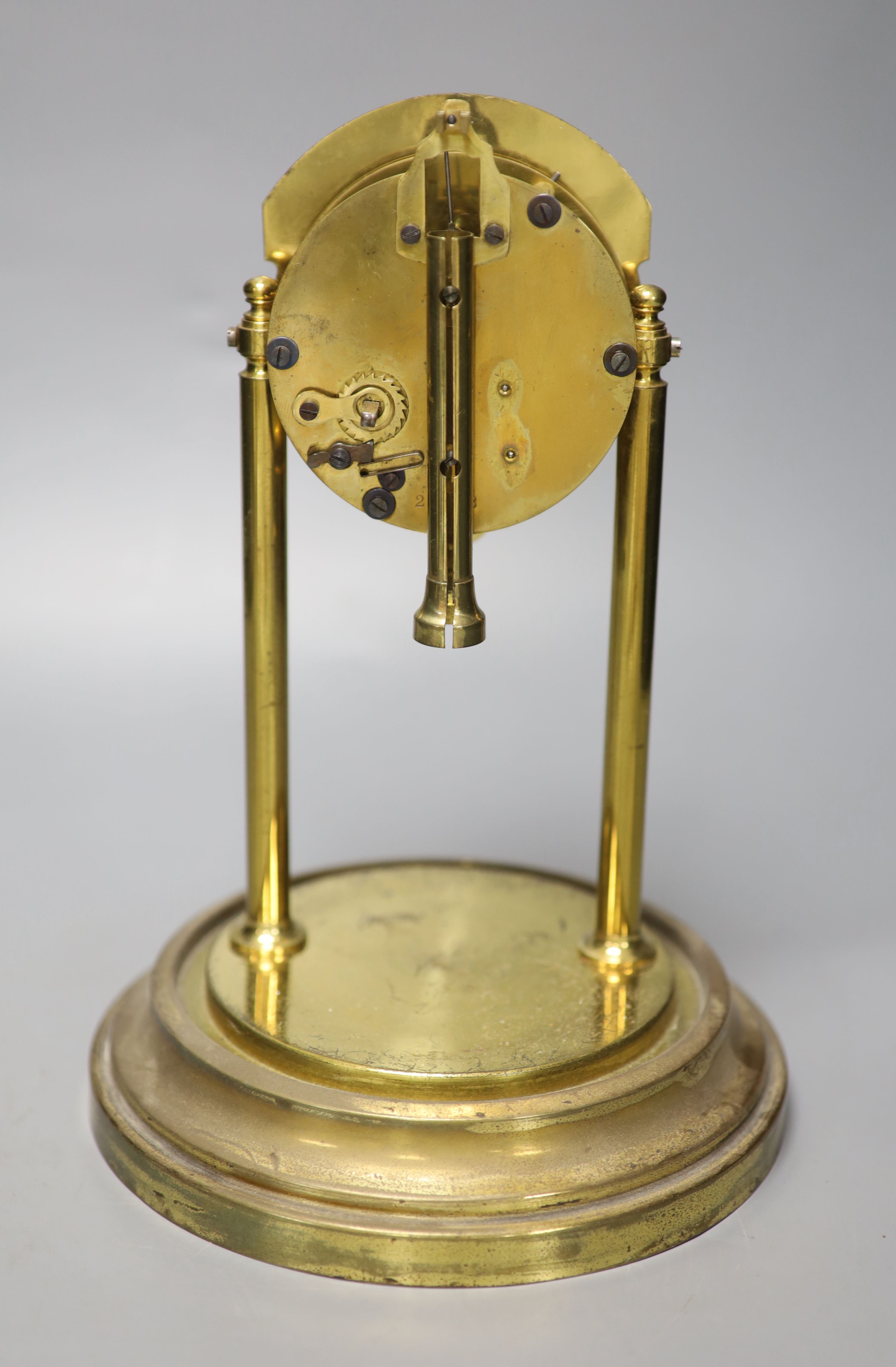 A brass electric mantel clock, under a glass dome, overall height 30cm